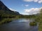 Fly fisherman in Norway River on sunny day