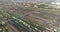 Fly over a large railway junction. Freight trains stand at the railway junction top view