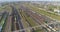 Fly over a large railway junction. Freight trains stand at the railway junction top view