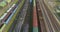 Fly over a large railway junction. Freight trains stand at the railway junction top view