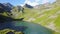 Fly over mountain lake and cabin, Switzerland