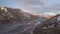 Fly over river delta in rainbow mountains in epic Icelandic nature