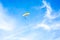 Fly on paramotor On the blue sky and white clouds