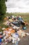 Fly tipping of household waste in a country lane. Hertfordshire. UK