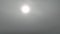 Fly up through thick cloud to clear sky with Sun above clouds. Aerial video