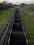 Fly view of railway tracks and empty freight train