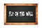 FLY  ON  THE  WALL text written on wooden frame school blackboard