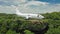 Flyby of airplane on edge of cliff in green tropical paradise. Abandoned aircraft in Bali island with panoramic ocean