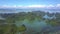 Flycam Shows Bay with Large Small Islands and Floating Farms