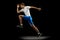 Flyer with muscular, sportive man, male athlete, runner training isolated on dark studio background with spotlight