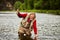 Flyfishing in river by mature fisherman