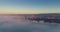 Flying above the clouds at sunrise, 4K video, aerial view
