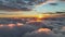 Flying above clouds at sunrise. Rising sun in the morning illuminates dense veil of clouds. Epic sunrise aerial shot