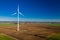 Flying above ecological wind turbines in a field