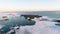 Flying above ice, top aerial view of arctic ice floes