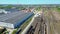 Flying above industrial railroad station with cargo trains and freight containers. Railroads and shipping container trains