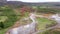 Flying above Strokkur geysir in Iceland, aerial high angle drone view