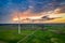 Flying above stunning wind turbines at sunset