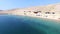 Flying above tourists on isolated beach of Pag island, Croatia