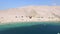 Flying above tourists on isolated beach of Pag island, Croatia