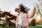 flying in the air curls of dark hair at a girl jumping in the park