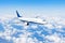 Flying a aircraft over fluffy cumulus clouds, aerial view