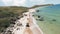 Flying along deserted empty uninhabited sand and stone beach of a tropical island. Shot. Aerial view of a sea coast with