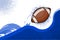 A flying american football ball abowe blue flat wave. Abstract background