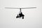 Flying autogyro silhouette on white background