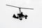 Flying autogyro silhouette on white background