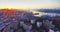 Flying backwards above Vladivostok city center at beautiful sunrise. Russia