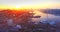 Flying backwards above Vladivostok city center at beautiful sunrise. Russia
