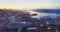 Flying backwards above Vladivostok city center at beautiful sunrise. Russia