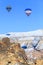 Flying balloons over mountains at sunset. Capadocia. Turkey.