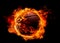 Flying basketball ball in flames on pure black background