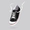 Flying black sneakers isolated on gray background. Fashionable stylish sports casual shoes.