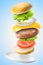 Flying classic hamburger on blue background