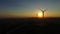 Flying close to windmill blades at dusk