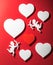 Flying cupid silhouette with hearts,  happy Valentine`s Day banners, paper art style. Amour on red paper