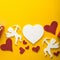 Flying cupid silhouette with hearts, happy Valentine`s Day banners, paper art style. Amour on yellow paper