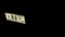Flying dollars isolated on black background close-up