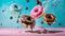 Flying doughnuts on blue and pink background