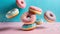 Flying doughnuts on blue and pink background