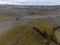 Flying drone above colorful autumn sangiovese grapes vineyards near wine making town Montalcino, Tuscany, rows of grape plants