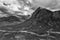 Flying drone epic black and white landscape image of Buachaille Etive Mor and surrounding mountains and valleys in Scottish