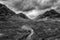 Flying drone epic  black and white landscape image of Buachaille Etive Mor and surrounding mountains and valleys in Scottish