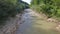 Flying drone over a fast mountain stream