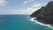 Flying drone over the ocean. View of makapuu lighthouse. Waves of Pacific Ocean wash Rocky shore. Magnificent mountains