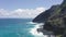 Flying drone over the ocean. View of makapuu lighthouse. Waves of Pacific Ocean wash Rocky shore. Magnificent mountains