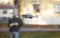 Flying drone remotely controlled by blurred man